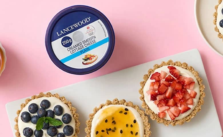 Healthy mini breakfast cheesecakes topped with fresh fruit