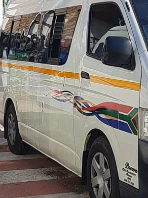 A taxi riddled with bullet holes.