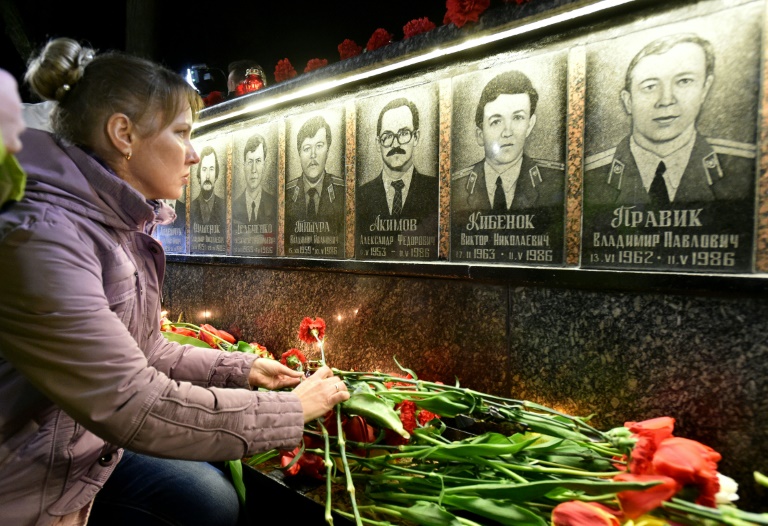 AFP / Genya SavilovA woman pays tribute at the monument to Chernobyl victims in Slavutich, where many of the power station's staff used to live, on April 26, 2015
