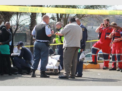 Police talk about the shooting while on the scene just outside Cresta Shopping Centre. Picture: Randburg Sun