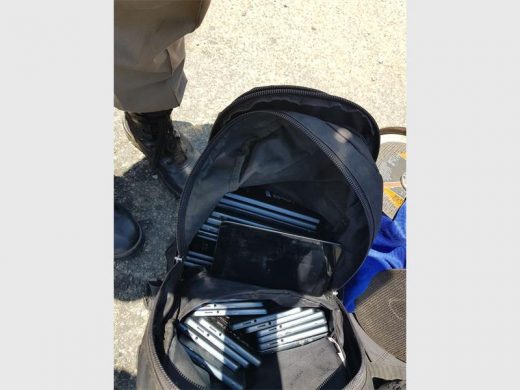 The suspects’ bag contains tablets and cellphones.