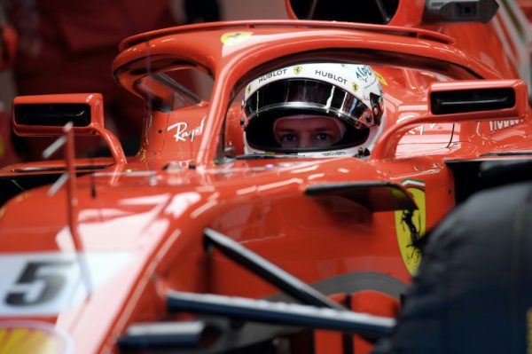 Ferrari's Sebastian Vettel peers out of his cockpit through the halo at pre-season testing
