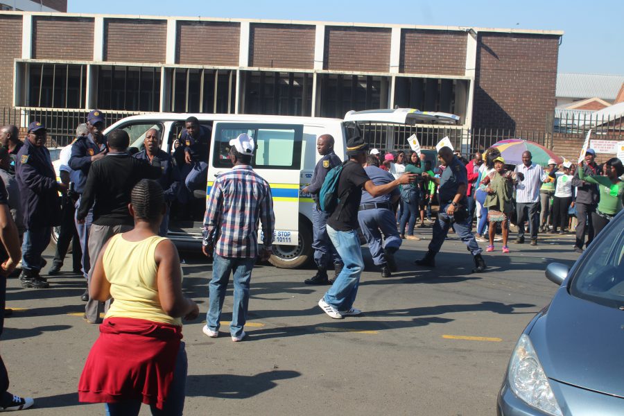 Striking Pietermaritzburg shoe factory workers block road, throw eggs