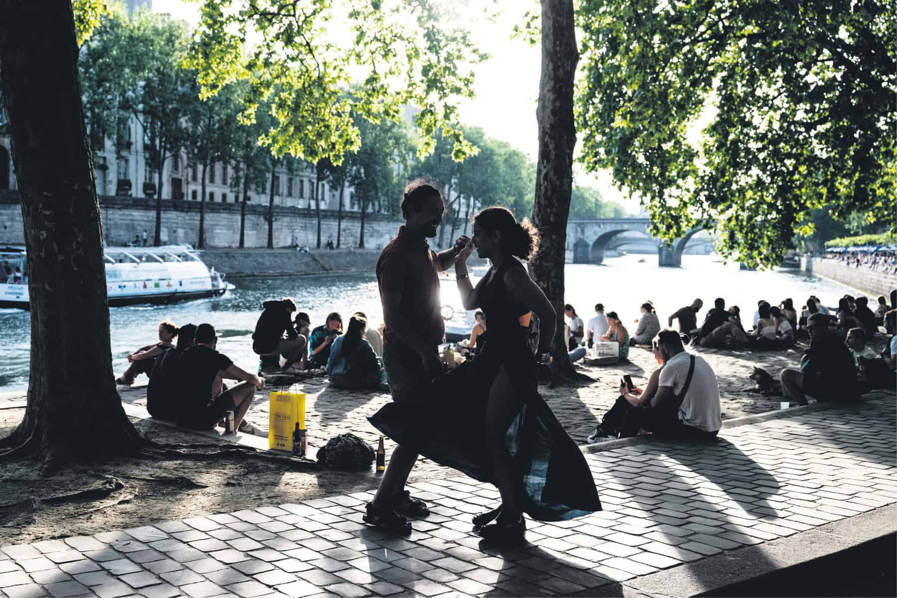 CITY OF LOVE. A couple dance on the Quai des Celestins along the River
Seine, in central Paris. Picture: AFP