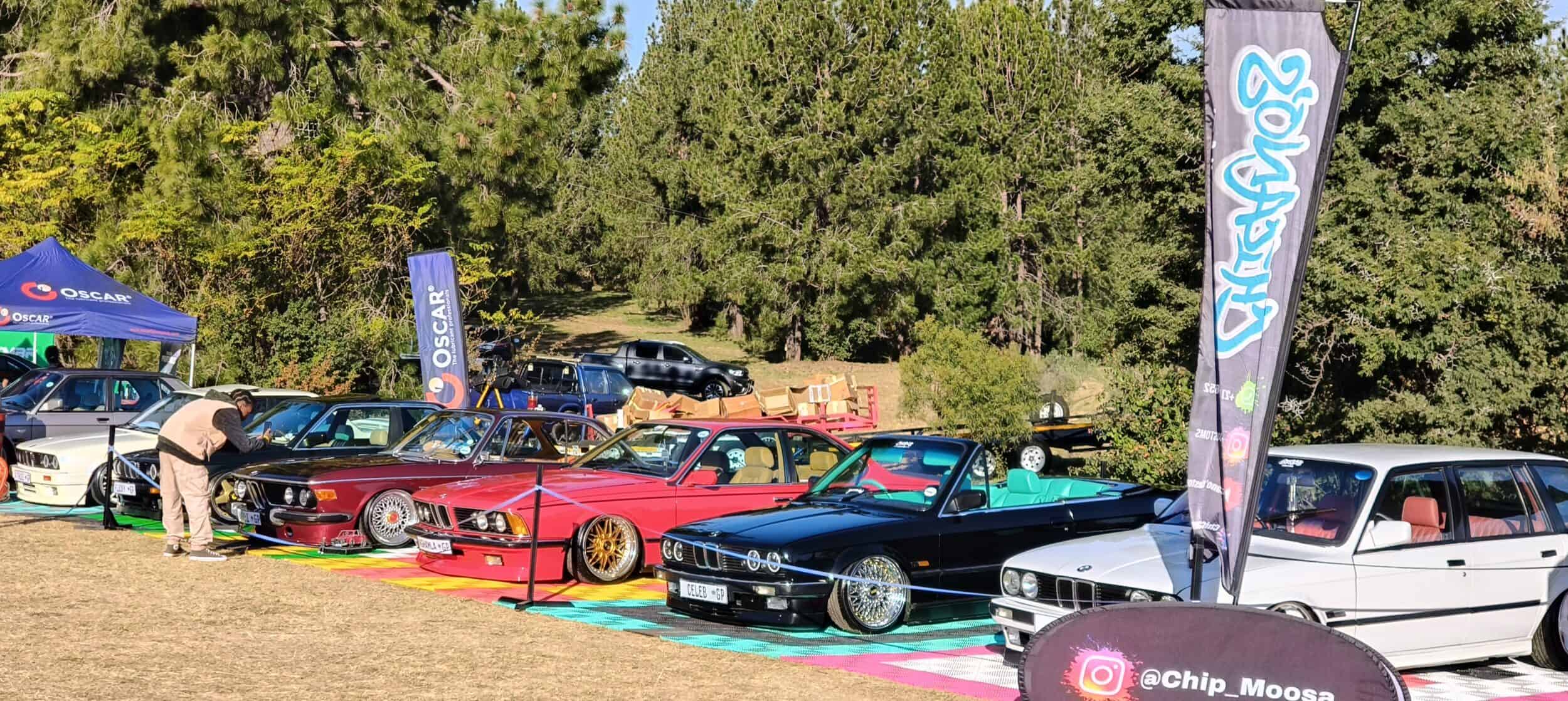 BMW's on display at a car show.