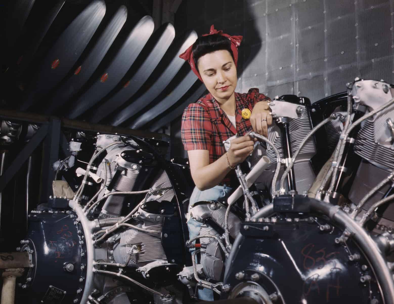 Woman working on an airplane motor at North American Aviation, Inc., plant in Calif. Artist Alfred T Palmer. Picture via Heritage Art/Heritage Images via Getty Images