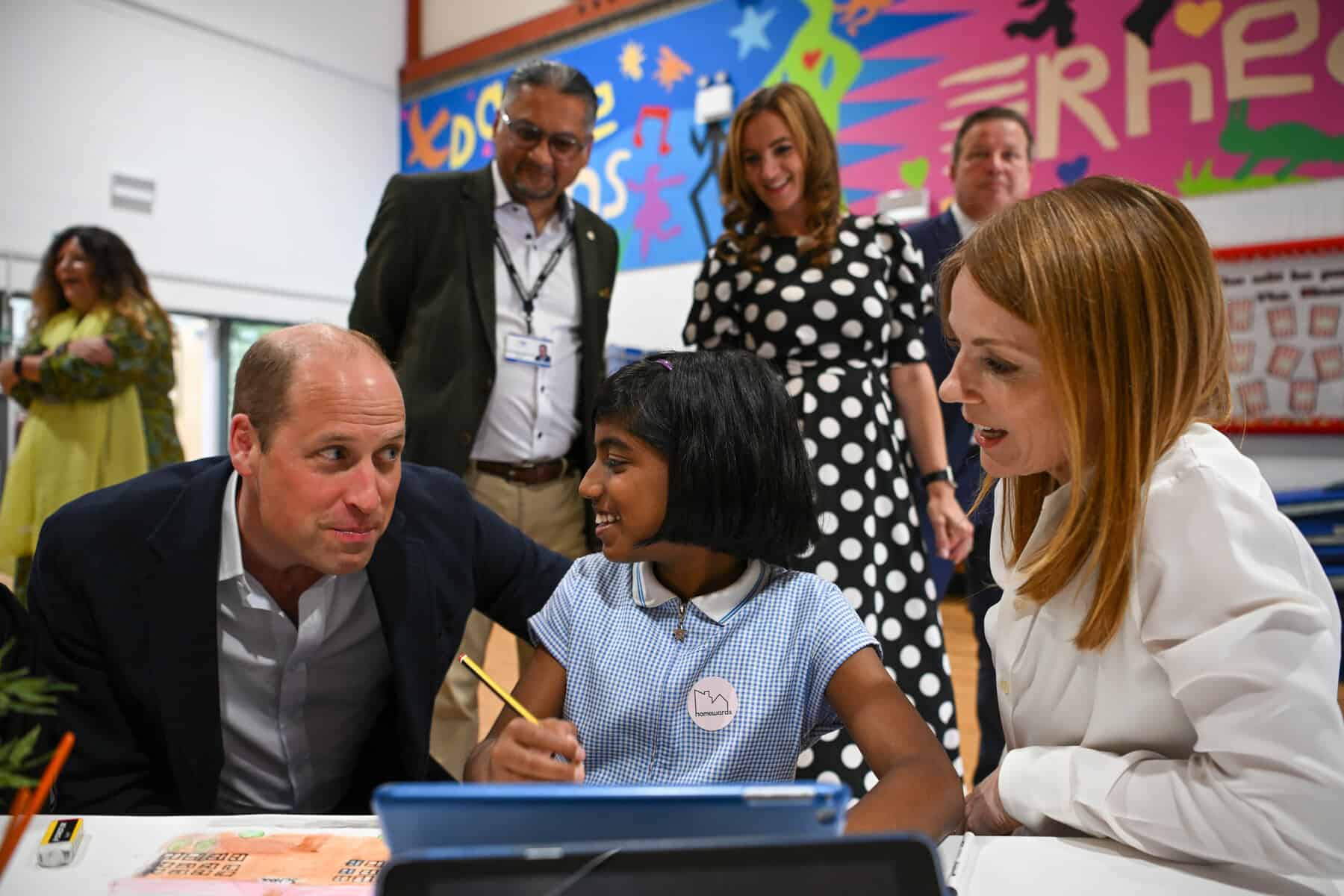 NEWPORT, WALES - JUNE 26: Prince William, Prince of Wales and Geri Halliwell meet children during a visit to Maindee Primary School on June 26, 2023 in London, England. The Prince of Wales has launched Homeward, a five-year programme delivered by the Royal Foundation, which will aim to demonstrate the possibility of ending homelessness. He is currently on a 2 day tour of the United Kingdom, visiting charities working to prevent homelessness in England, Scotland and Wales. (Photo by Finnbarr Webster/Getty Images)